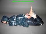 Get 101 Pictures with Lupi tied and gagged in shiny nylon rainwear from 2005-2008!