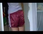 Sexy Sandra examine the cupboard with shiny nylon shorts and posing in shiny nylon shorts and a top (Video)