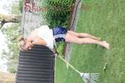 Watching sexy Sandra wearing a oldschool blue shiny shorts and a top while gardening outside (Video)