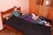 Catt and Alexa - Naughty girl tied up before joining helpless girlfriend on the bed