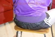 Mara tied and gagged with cable ties on a chair wearing a sexy shiny silver leggings and a shiny nylon shorts in black/white as well as a black purple rain jacket (Pics)