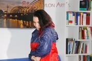 Jill posing and playing with you and herself wearing a sexy red shiny nylon shorts and an oldschool red/blue rain jacket (Pics)