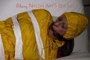 Watching Pia being tied and gagged with tape and a cloth gag wearing sexy yellow shiny nylon rainwear (Pics)