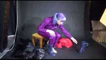 Mara wearing sexy purple rainwear trying on a black down pants and a red down jacket infront of the camera (Video)