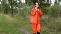 Miss Petra takes a walk in a orange AGU rain suit and rubber boots