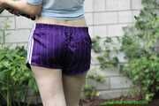 Watch Chloe watering the Garden enjoying her shiny nylon Shorts