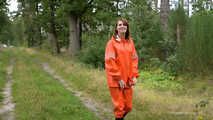 Miss Petra takes a walk in a orange AGU rain suit and rubber boots