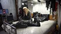 Leather mistress and rubber slave