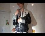 Sonja taking a bath wearing a sexy black shiny nylon shorts and a black rain jacket (Video)