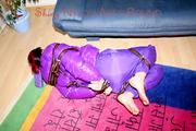 Jill tied and gagged with webbing load restraint assembly on the floor wearing a sexy purple down jacket and a rain pants (Pics)