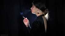 Irina is smoking 100mm cigarette in the dark room