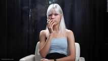 Ash hair color girl is smoking two cigarettes