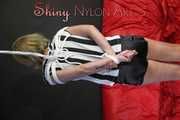 Sexy Pia wearing a sexy black shiny nylon shorts and a top being tied and gagged with ropes and a cloth gag overhead (Pics)