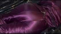 Watching Lucy preparing her sofa with a black shiny nylon cloth for lolling with a sexy purple downsuit on the sofa (Video)