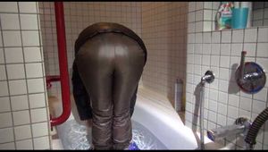 Watching Sandra wearing sexy shiny downwear taking a bath (Video)