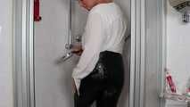 Blonde Frida takes a shower in her white shirt and black glossy pants