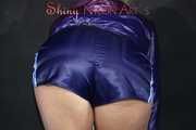 Watching sexy Pia in a sexy oldschool blue shiny nylon shorts and a special rain jacket posing for you on a little chair (Pics)