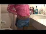 SEXY ENNI wearing a hot lightblue shiny nylon shorts and a pink shiny nylon rain jacket during sorting the cloths (Video)
