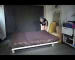 Mara preparing her bed wearing a sexy blue/purple shiny nylon shorts and a t-shirt (Video)
