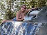 Nathalie poses on a Hotchkiss armored personnel carrier