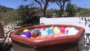 a jakuzzi full of balloons