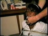 26 YR OLD BLACK BANK TELLER IS MOUTH STUFFED, HANDGAGGED, CLEAVE GAGGED, BALL-GAGGED, BAREFOOT & BALL-TIED ON THE FLOOR (D55-7)