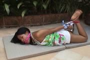 Video of innocent Ahm left struggling outside in a nice tight hogtie