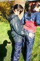 Jill and her friend in the garden playing with eachother wearing sexy shiny nylon rainwear (Pics)