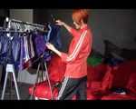 SONJA wearing a sexy black shiny nylon rain pants and an oldschool red rain jacket sorting shiny nylon shorts (Video)