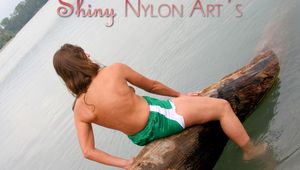 Stella posing and lolling in a sexy green shiny nylon adidas shorts outdoor in and on a lake (Pics)