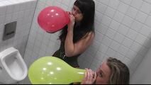 Two girls at the mens toilet