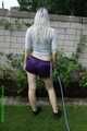 Watch Chloe watering the Garden enjoying her shiny nylon Shorts