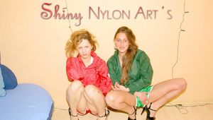 Leonie and Stella posing and having fun with eachother wearing supersexy shiny nylon shorts and rain jackets (Pics)