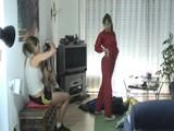 Leonie and Lea trying on different shiny nylon clothes (Video)