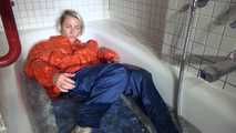 Sexy Sonja taking a bath in the bath tub wearing a sexy shiny nylon down jacket and a rain pants (Video)