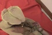 Video: Helpless asian girl in a hogtie struggling on the couch, Wearing only pantyhose, gag and ropes
