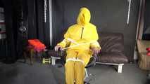 Sandra being tied and gagged on a hairdresser´s chair wearing sexy yellow shiny nylon rainwear being double hooded (Video)