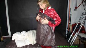 Watch Pia enjoying her shiny nylon Oldschool Rainwear in her shiny nylon Bedsheets