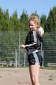 Leonie playing soccer outdoor wearing a sexy black shiny nylon shorts and a sexy black rain jacket (Pics)