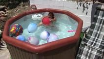 a jakuzzi full of balloons