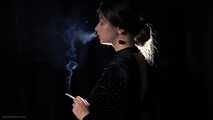 Irina is smoking 100mm cigarette in the dark room