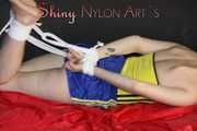 *** Sexy MIA wearing a hot blue oldschool shiny nylon shots and a yellow top being tied and gagged with ropes and a clothgag on a sofa (Pics)