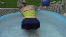 Watching sexy Sonja enjoying the water in the pool and the feeling of shiny nylon on her skin wearing a sexy shiny nylon shorts and a top (Video)