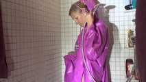 Watching Sandra wearing only a pink shiny nylon raincape under the shower playing with the water (Video)