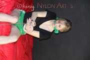 Watching ***NEW MODELL MIA*** during her selfbondage with cuffs and a clothgag wearing a sexy green shiny nylon shorts and a black top (Pics)