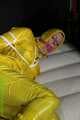 Get Pictures of Pia bound and gagged in her yellow shiny nylon Rainwear