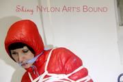 Mara tied, gagged and hooded in a cellar wearing sexy shiny nylon down pants and down jacket (Pics)