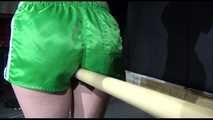 SEXY SONJA tied and gagged with ropes and a bar with a massager between her legs wearing a sexy green shiny nylon shorts and a sexy black rain jacket (Video)