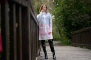 Miss Petra in hot vinyl skirt, overknee boots and raincoat at the photo shoot