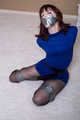 Kitty Quinzell in blue dress and silver tape